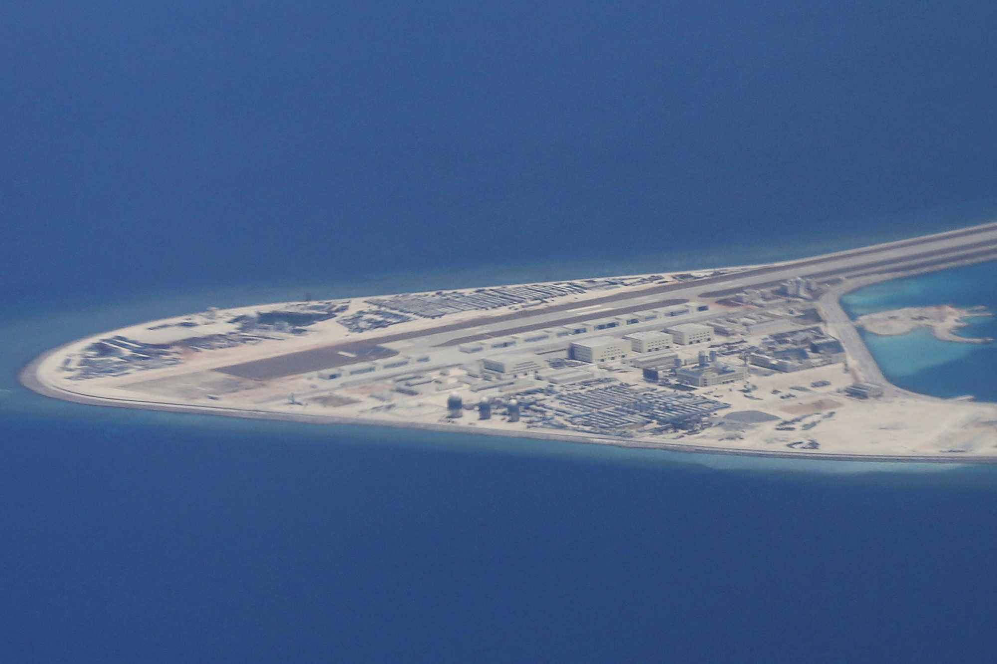 An airstrip and other structures are seen on China's man-made Subi Reef in the South China Sea's Spratly chain of islands on April 21, 2017. China has built seven islands in the Spratlys. | AP