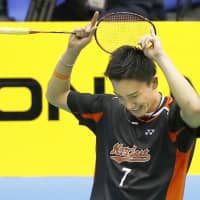 Kento Momota celebrates after winning the men\'s singles tournament at the national badminton championships on Sunday at Komazawa Gymnasium. | KYODO