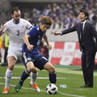 Samurai Blue head coach Hajime Moriyasu reacts during the team\'s Oct. 16 friendly against Uruguay in Saitama. Moriyasu has announced his intent to take a full-strength squad to next year\'s Copa America, where Japan will participate as invited guests. | KYODO