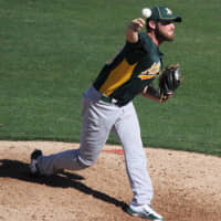 Ryan Cook pitches for the Oakland Athletics in a March 2012 spring training game. | UCINTERNATIONAL / WIKIMEDIA COMMONS