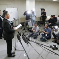 Norifumi Yamamoto of the Japan Gymnastics Association announces the organization\'s decision to rescind the provisional suspension of coach Chieko Tsukahara and her husband and association vice president Mitsuo Tsukahara on Monday. | KYODO