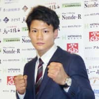 Boxer Takeshi Inoue poses for photos on Wednesday. | KYODO