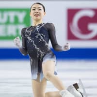 Rika Kihira reacts after her free skate at the Grand Prix Final on Saturday in Vancouver, British Columbia. She became the first Japanese woman to win the title since Mao Asada in 2013. | AP