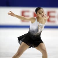 Kaori Sakamoto performs her free skate during the final day of the national championships on Sunday night in Kadoma, Osaka Prefecture. Sakamoto scored 152.36 points to win the women\'s competition with a combined score of 228.01. | CRAIG BAILEY / FLORIDA TODAY / VIA AP