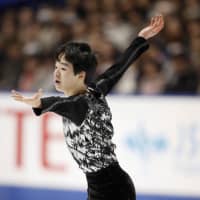 Yuma Kagiyama performs during the men\'s free skate at the national championships on Monday in Kadoma, Osaka Prefecture. The 15-year-old finished in sixth with 216.36 points. | KYODO