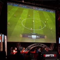 Competitors participate in an esports competition during the 2018 Tokyo Game Show in September. | JASON COSKREY