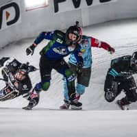 A group of riders try to keep their footing during a men\'s heat at Crashed Ice on Saturday in Yokohama. | JASON HALAYKO / RED BULL CONTENT POOL