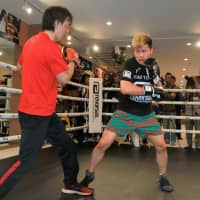 Kickboxer Tenshin Nasukawa practices with trainer Yuichi Kasai on Tuesday at Teppen Gym. | KAZ NAGATSUKA