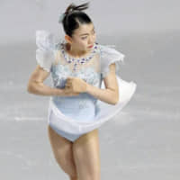 Rika Kihira performs in the short program at the Grand Prix Final in Vancouver, British Columbia, on Thursday night. Kihira posted a world record with 82.51 points to take the lead. KYODO | KYODO