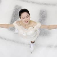 Satoko Miyahara performs her short program at the Japan championships on Friday night in Kadoma, Osaka Prefecture. Miyahara is in first place with 76.76 points. | KYODO