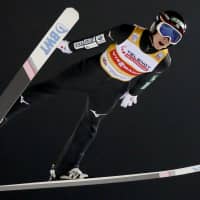 Ryoyu Kobayashi competes in a ski jumping World Cup event on Sunday night in Nizhny Tagil, Russia. Kobayashi won the event to claim his third title of the season. | KYODO