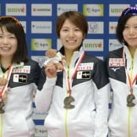Ayano Sato (left) Konami Soga (center) and Miho Takagi stand on the podium after winning the  team sprint at an ISU World Cup event on Sunday in Tomaszow Mazowiecki, Poland. | KYODO
