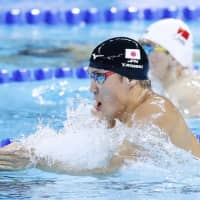 Yasuhiro Koseki competes in the men\'s 100-meter breaststroke final at the FINA Short Course World Swimming Championships on Wednesday in Hangzhou, China. | KYODO