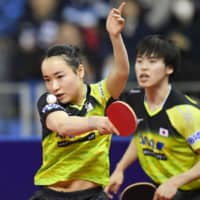 Mima Ito hits a return in a women\'s doubles semifinal on Friday at the ITTF World Tour Grand Finals in Incheon, South Korea. | KYODO