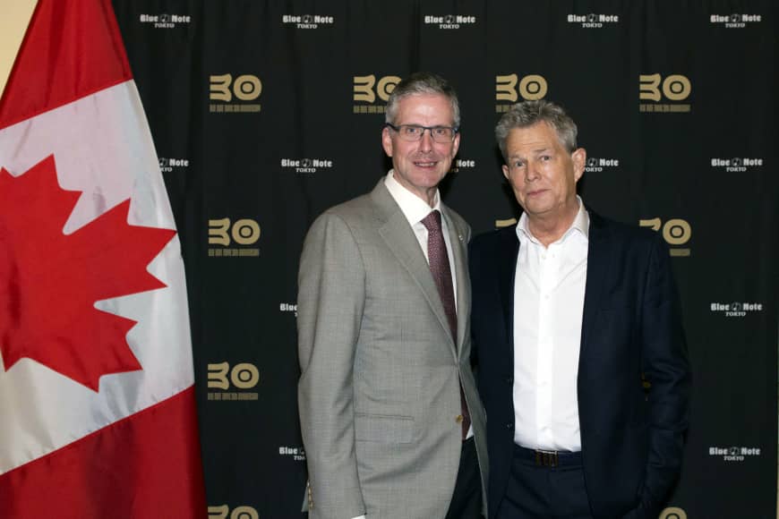 On Nov. 29, Canadian Ambassador to Japan Ian Burney (left) poses with Canadian musical genius  David Foster (right) at a mini-live, talk show and cocktail reception to celebrate the eve of the 90th anniversary of Canada-Japan diplomatic relations and the 30th anniversary of  Blue Note Tokyo