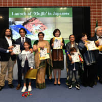 On Nov. 26, the Embassy of Bangladesh in Tokyo hosted a launch event for the Japanese translation of the graphic novel &#34;Mujib.&#34; Radwan Mujib Siddiq, publisher of &#34;Mujib&#34; (third from left), Bangladesh Ambassador Rabab Fatima (fourth from left), Akie Abe, wife of Prime Minister Shinzo Abe (center), Sheikh Rehana, daughter of Bangabandhu Sheikh Mujibur Rahman (fourth from right), Toshiko Abe, state minister for foreign affairs (third from right), and Masaaki Ohashi, Japanese translator of &#34;Mujib&#34; (second from right), pose with copies of the book. | YOSHIAKI MIURA