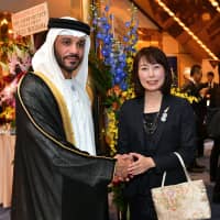 United Arab Emirates Ambassador Khaled Alameri (left) welcomes Naoko Yamazaki (right), astronaut, engineer and member of Japan\'s Space Policy Committee, during a reception to celebrate UAE\'s 47th national day at Hotel Gajoen Tokyo on Dec. 4. | YOSHIAKI MIURA