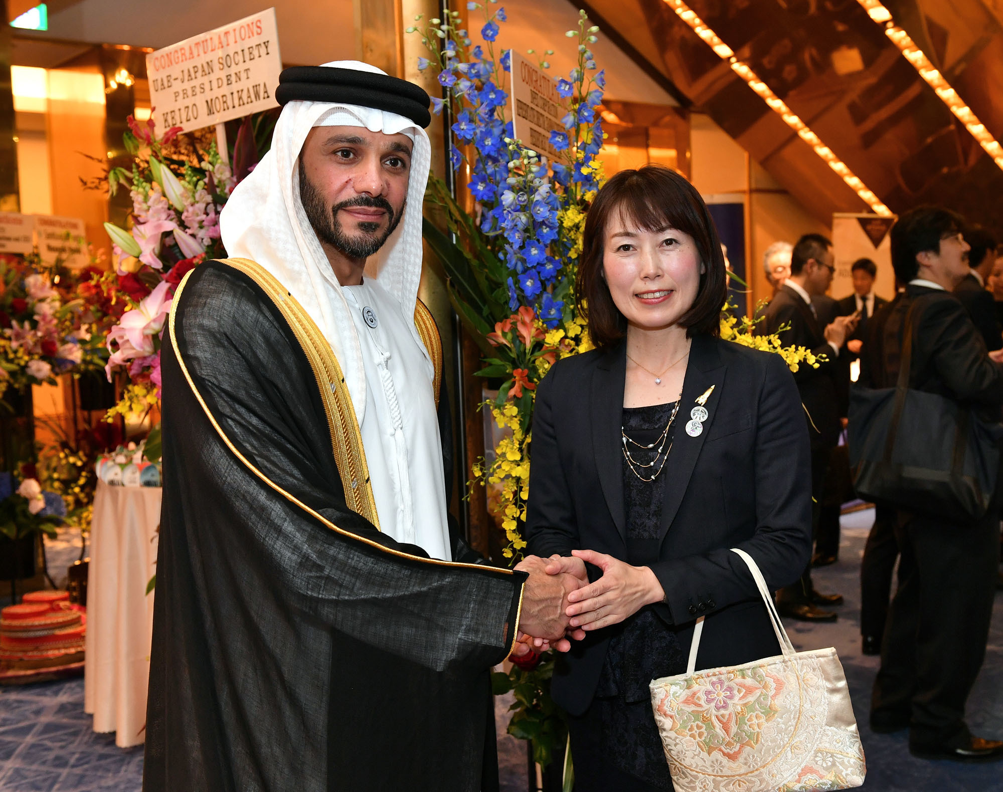 United Arab Emirates Ambassador Khaled Alameri (left) welcomes Naoko Yamazaki (right), astronaut, engineer and member of Japan's Space Policy Committee, during a reception to celebrate UAE's 47th national day at Hotel Gajoen Tokyo on Dec. 4. |  YOSHIAKI MIURA