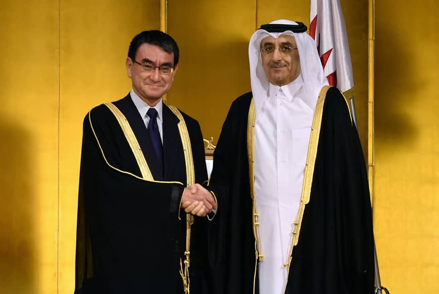 Qatari Ambassador Hassan Bin Mohammed Rafei Al-Emadi (right) shakes hands with Foreign Minister Taro Kono (left) during a reception to celebrate the anniversary of  Sheikh Jassim Bin Mohamed Bin Thani