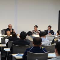 Panelists hold a discussion on education and regional revitalization in a symposium co-hosted by the Japan Times Satoyama Consortium in Jinsekikogen, Hiroshima Prefecture, on Oct. 20. | SHINOBU YAMADA