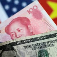U.S. dollar and China yuan notes are seen in 2017. | REUTERS