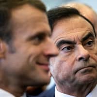 French President Emmanuel Macron (left) and Renault CEO Carlos Ghosn visit the Renault factory in Maubeuge, France, Nov. 8. | REUTERS