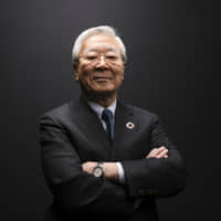 Hiroaki Nakanishi, chairman of Hitachi Ltd., poses for a photograph on the second day of the World Economic Forum in Davos, Switzerland, on Wednesday. | BLOOMBERG