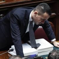 Italian deputy Prime Minister Luigi Di Maio attends a debate prior to a final vote to formally approve the 2019 budget law, at the Italian lower chamber of the Italian Parliament in Rome Sunday. The Italian government has already won Saturday night a confidence vote on the 2019 national budget that includes funding to realize campaign promises made by leaders of Italy\'s populist government. | GIUSEPPE LAMI / ANSA / VIA AP