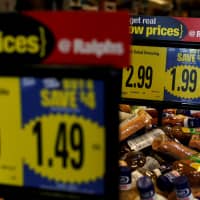 Price tags are pictured at a Ralphs grocery store, which is owned by Kroger Co., ahead of company results in Pasadena, California, in 2016. | REUTERS