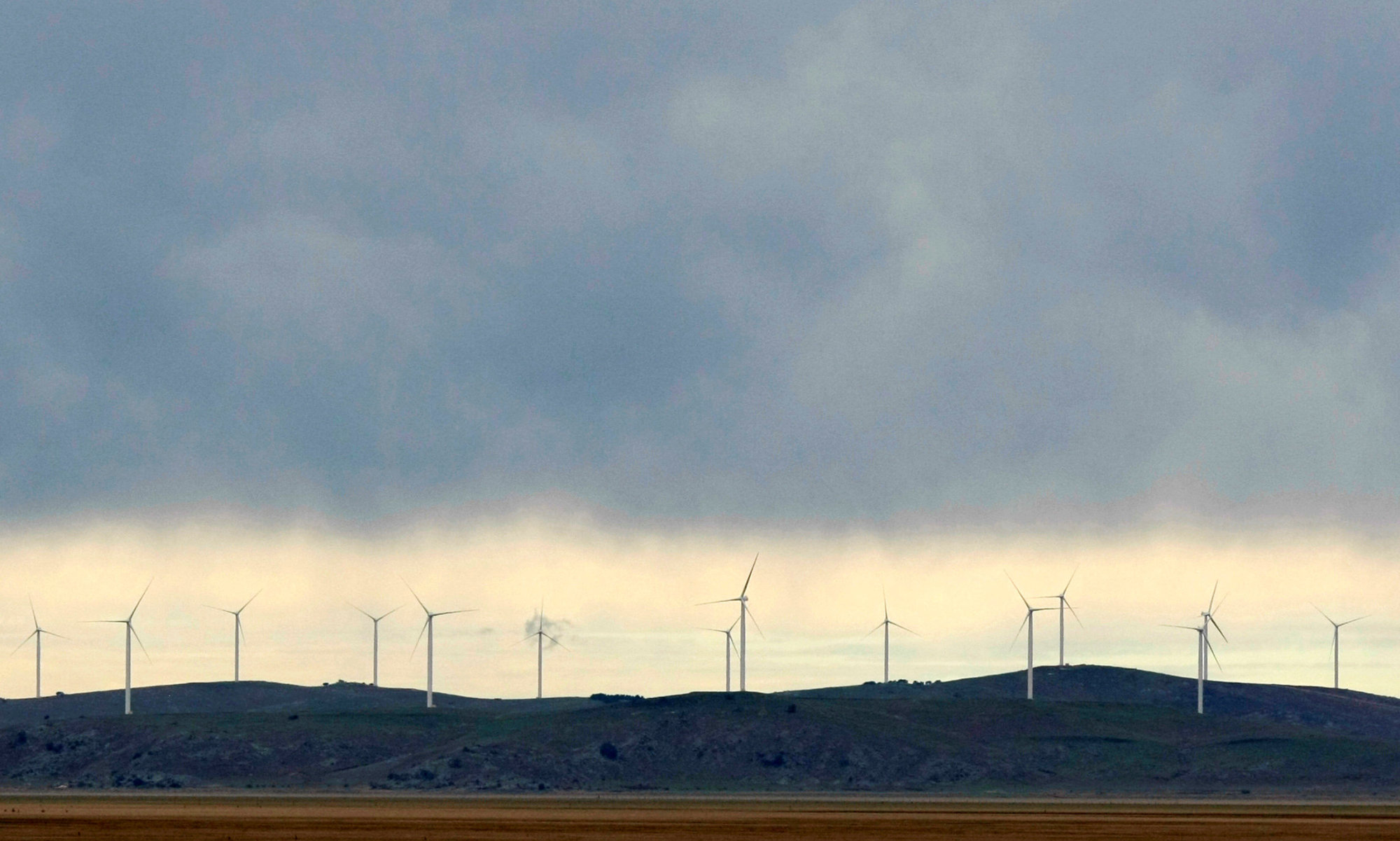 Newly constructed wind turbines stand on a hillside at Lake George, north of Canberra, in 2009. | REUTERS
