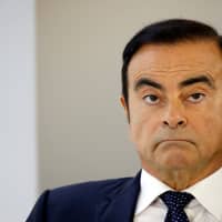 Carlos Ghosn, then-chairman and CEO of the Renault-Nissan-Mitsubishi Alliance, attends a press conference on the second press day of the Paris auto show in Paris in October. | REUTERS