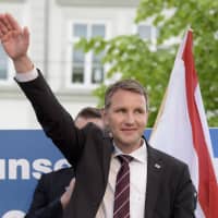 Head of the AfD in Thuringia, Bjoern Hoecke, smiles during a rally of the Alternative for Germany party in Erfurt, eastern Germany, in 2016. | AP