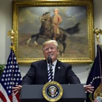 President Donald Trump talks about immigration and gives an update on border security from the Roosevelt Room of the White House in Washington Nov. 1. The Trump administration expects to launch a policy as early as Friday that forces people seeking asylum to wait in Mexico while their cases wind through U.S. courts, an official said. | AP