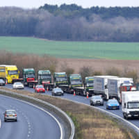 A line of trucks is seen during a trial that was held between disused Manston Airport and one of the U.K.\'s most important shipping hubs, the Port of Dover, to test how the area\'s roadways and ferry system would cope in the event of a no-deal Brexit. | REUTERS