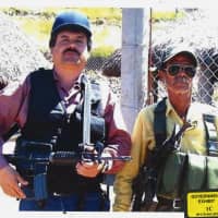 In this undated photo provided by the United States Attorney\'s Office for the Eastern District of New York, Joaquin \"El Chapo\" Guzman (left) poses with an unidentified man. Text messages sent by the Mexican drug lord known as El Chapo about narrowly avoiding capture in 2012 have become the latest damaging evidence at his U.S. trial. Prosecutors presented the texts Wednesda in federal court in Brooklyn, where Guzman has pleaded not guilty to drug-trafficking charges. | UNITED STATES ATTORNEY\'S OFFICE FOR THE EASTERN DISTRICT OF NEW YORK / VIA AP