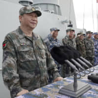Chinese President Xi Jinping speaks after reviewing the Chinese People\'s Liberation Army naval fleet in the South China Sea in April 2018. | AP