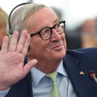 European Commission President Jean-Claude Juncker waves prior to a debate during a plenary session at the European Parliament on Jan. 15 in Strasbourg, eastern France. | AFP-JIJI