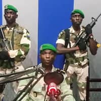 Video footage posted on YouTube on Monday shows Gabon soldiers on state radio calling on the people to \"rise up\" and announcing that a \"national restoration council\" would be formed, as an ailing President Ali Bongo is out of the country. | AFP-JIJI