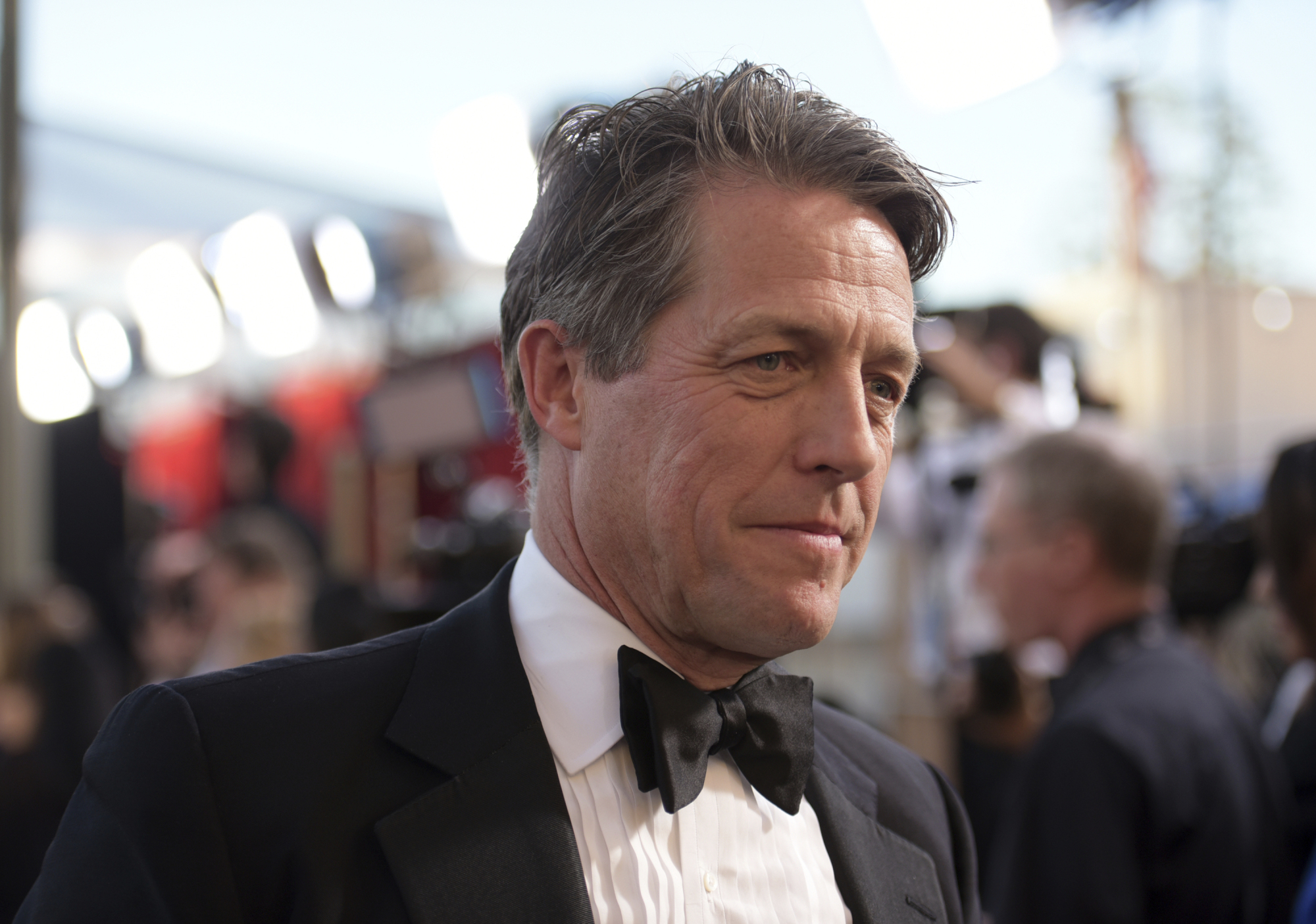 Hugh Grant arrives at the 23rd annual Screen Actors Guild Awards at the Shrine Auditorium &amp; Expo Hall in Los Angeles in 2017. The British actor tweeted a plea to the thief who broke into his car late Sunday: Please return the script that was inside. | RICHARD SHOTWELL / INVISION / VIA AP