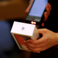 An iPhone X is sold in Beijing on Nov. 3. | REUTERS
