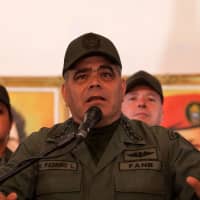 Venezuelan Defense Minister Vladimir Padrino speaks during a press conference Tuesday in Caracas. Padrino read a statement from the Bolivarian National Armed Forces in which they express their deep indignation and caterogical rejection of the recent statement made by the Lima Group &#8212;a bloc of Latin American powers and Canada &#8212; with the exception of Mexico &#8212; which has said it will not recognize the new President Nicolas Maduro-led administration set to begin Thursday. | AFP-JIJI