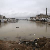Flooded tents of Syrian refugees are seen Monday in Bar Elias town, in the Bekaa valley of Lebanon. | REUTERS
