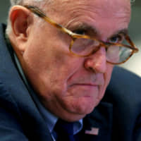 Former New York Mayor Rudy Giuliani waits to speak at the 2018 Iran Freedom Convention in Washington last May 5. | REUTERS