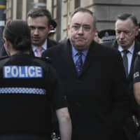 Alex Salmond leaves the Edinburgh Sheriff Court after his arrest in Edinburgh, Scotland, on Thursday. | AP