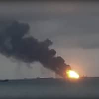 This video grab provided by the Kerch.fm web portal shows the vessels Maestro and Candiy on fire near the Kerch Strait linking the Black Sea and the Sea of Azov, in Kerch, Crimea, Monday. The two Tanzanian-flagged commercial vessels caught fire in the Black Sea, leaving at least 10 sailors dead, Russian officials said, and seven sailors are reported still missing. | KERCH.FM / VIA AP