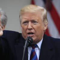 U.S. President Donald Trump, joined by congressional Republican leaders, speaks in the Rose Garden of the White House on Friday as the government shutdown continued. | AP
