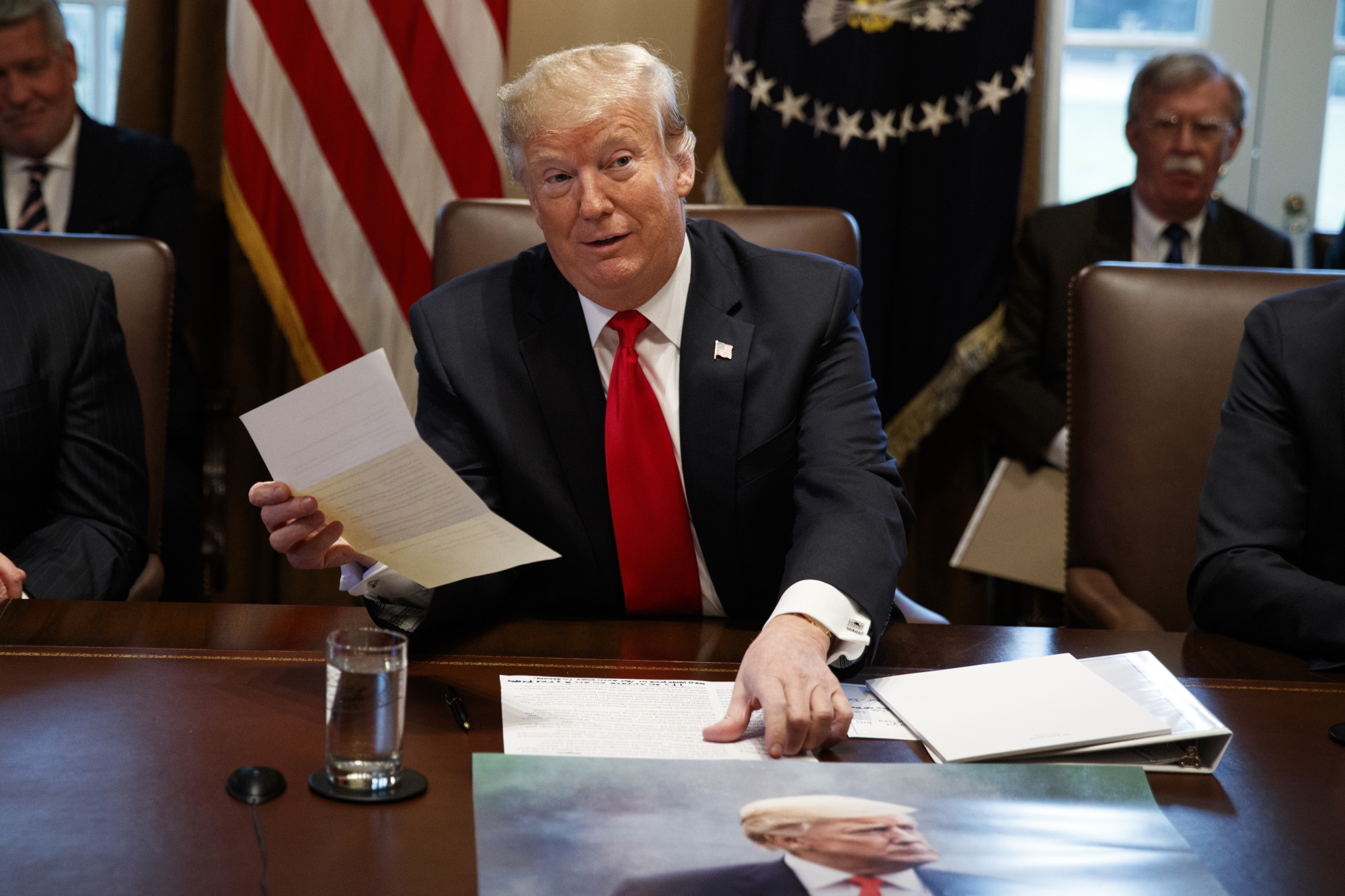 President Donald Trump holds up a letter he says is from North Korean leader Kim Jong Un during a Cabinet meeting at the White House Wednesday in Washington. | AP