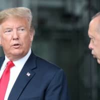U.S. President Donald Trump talks to Turkey\'s President Recep Tayyip Erdogan at NATO headquarters in Brussels on July 11, 2018. | REUTERS