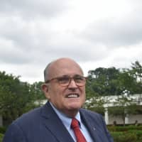 President Donald Trump\'s lawyer, Rudy Giuliani ,walks outside the White House before Trump delivers remarks and participates in the White House Sports and Fitness Day in Washington last May. Trump had conversations about a proposed project to build a Trump Tower in Moscow throughout the 2016 presidential campaign, far later than previously acknowledged, his lawyer said Sunday. | AFP-JIJI