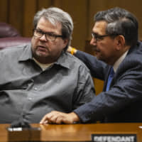 Jason Dalton talks with Eusebio Solis, his defense attorney, moments before pleading guilty to six counts of murder and several other charges at the Kalamazoo County Court on Monday in Kalamazoo, Michigan. | AP